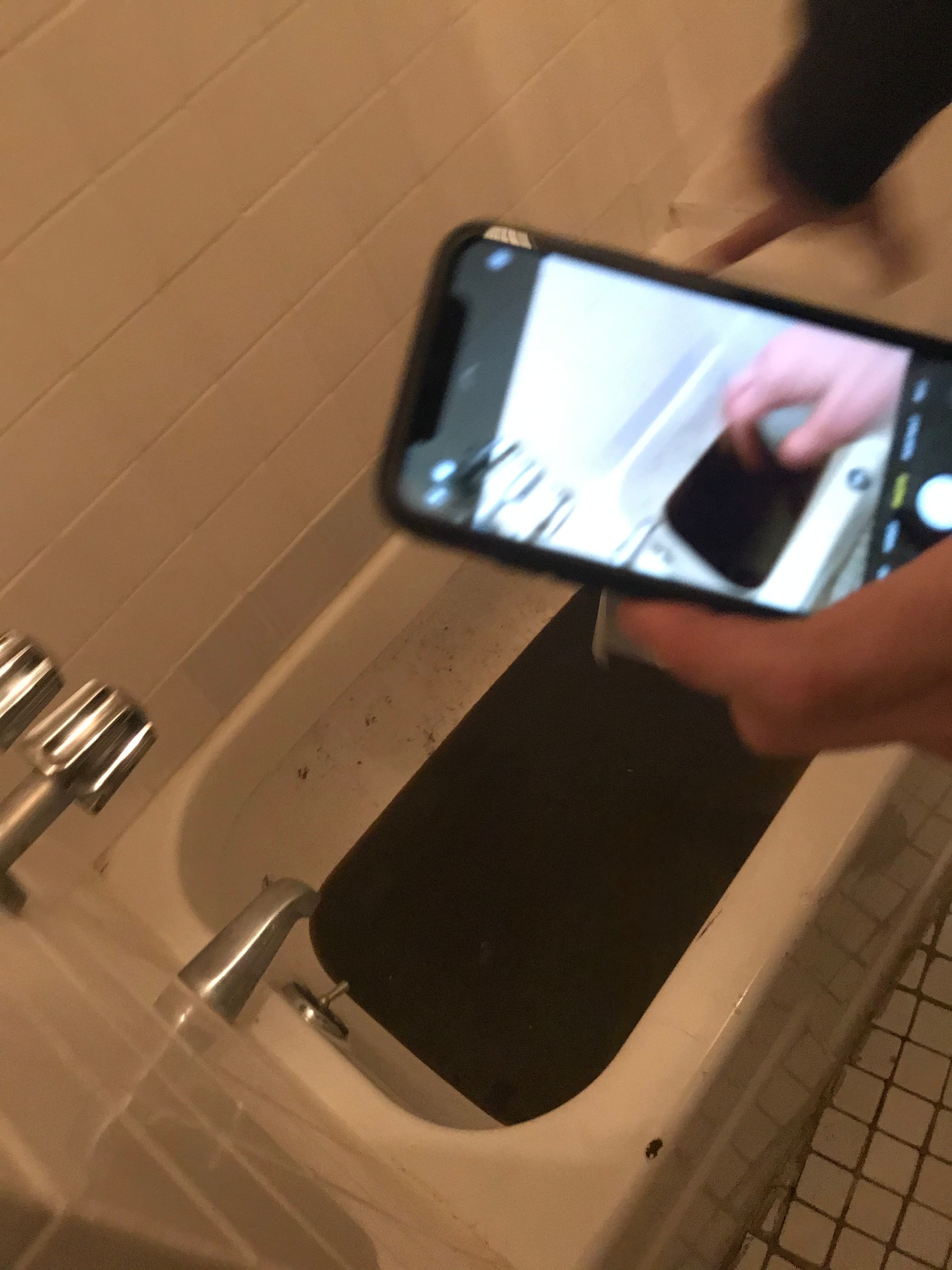 Dirty water sitting in the bathtub at 18 Gay Street after a plumbing backup, November 11, 2019