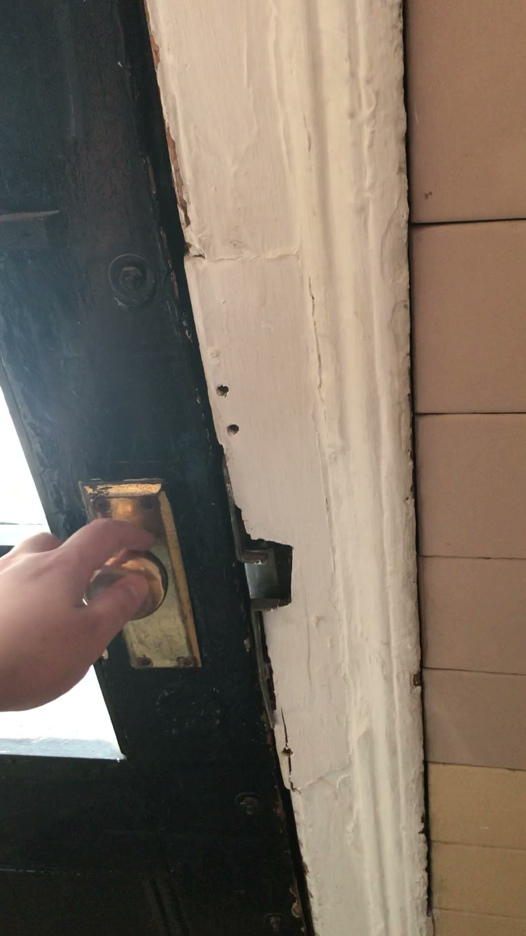 The broken front-door lock at 18 Gay Street, October 10, 2020