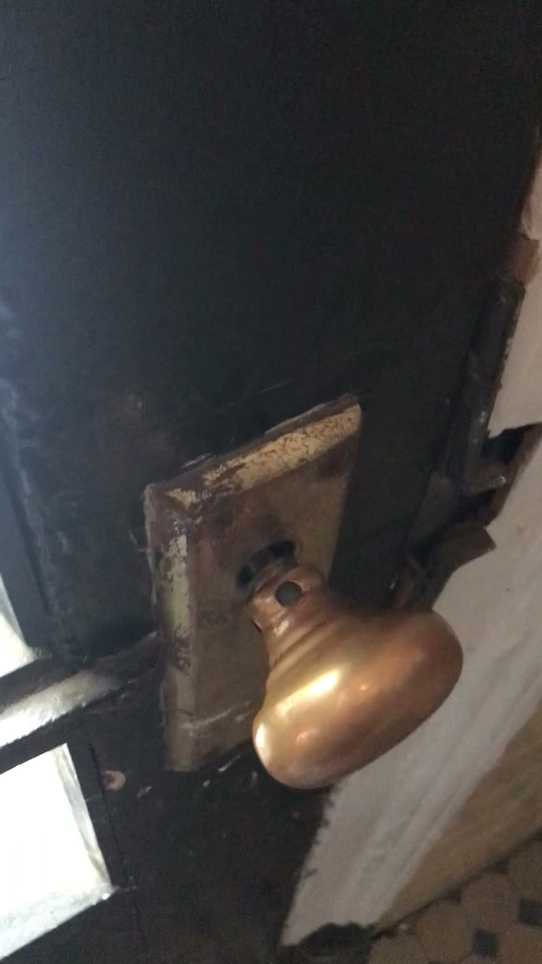 The broken front-door knob at 18 Gay Street, August 2, 2021
