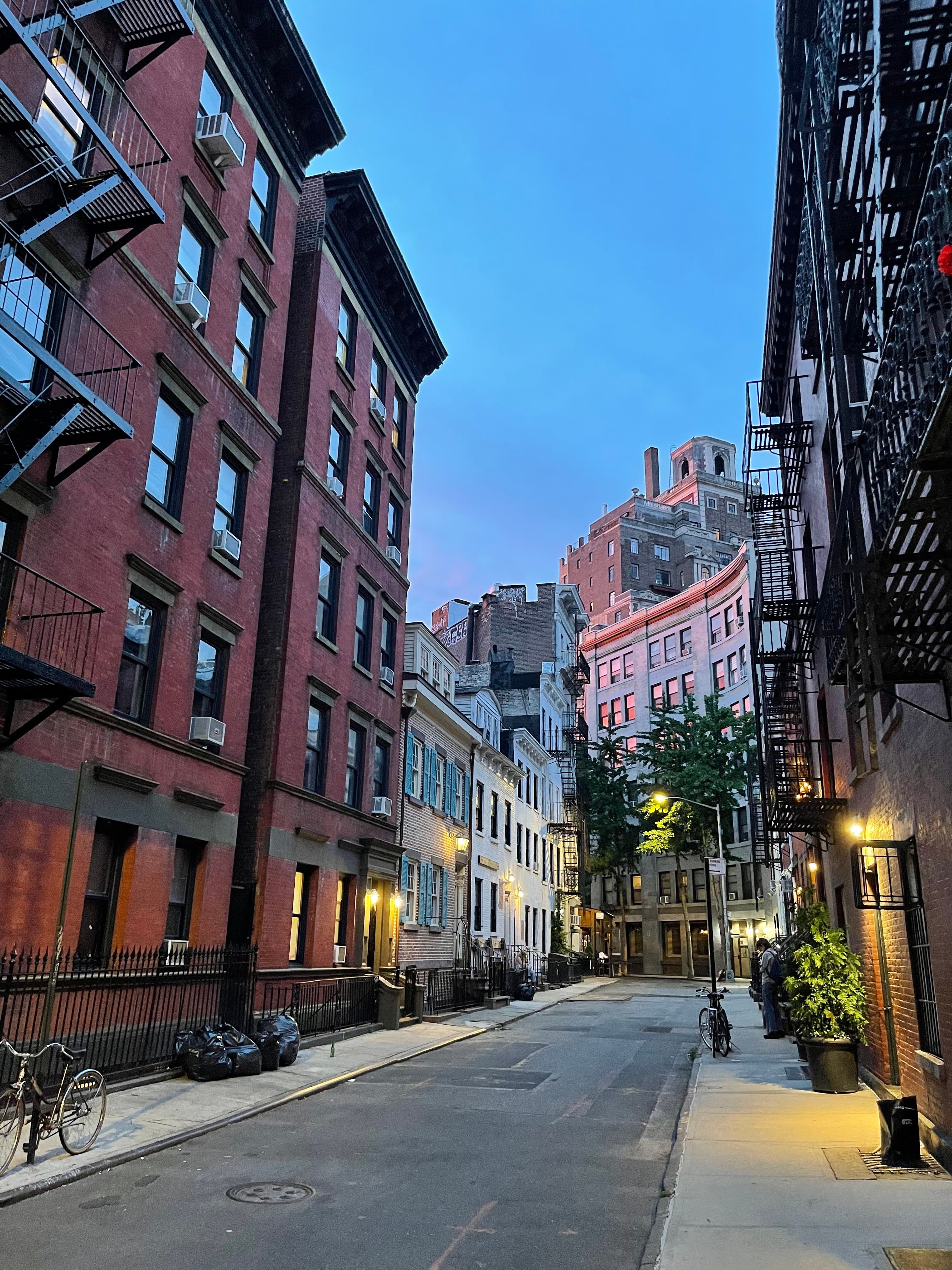 The bend of Gay Street at dusk on June 10, 2022 — shoring already in place holding up 14 Gay Street before any work under the new owners began