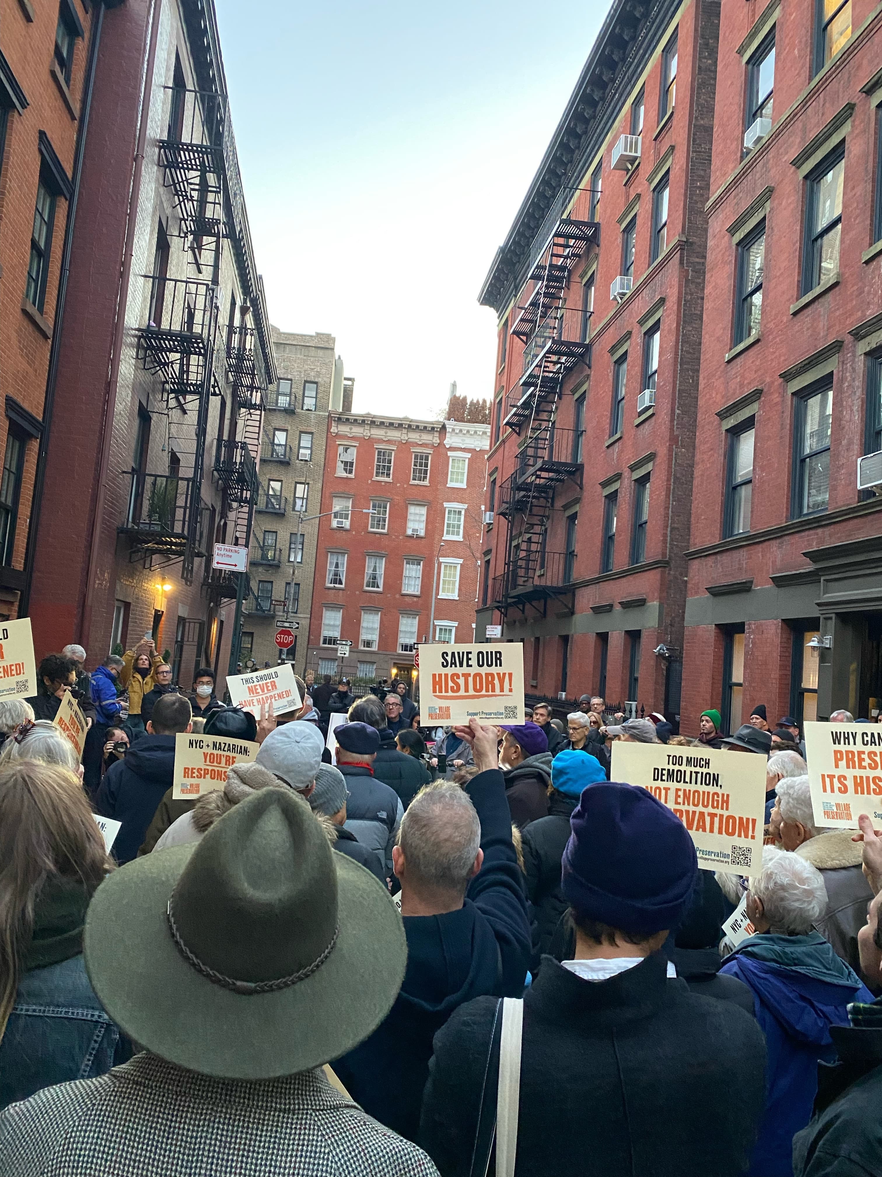 Signs at the November 14, 2022 protest against the demolition of 14 Gay Street, including one reading 'NYC + Nazarian: You're Responsible'
