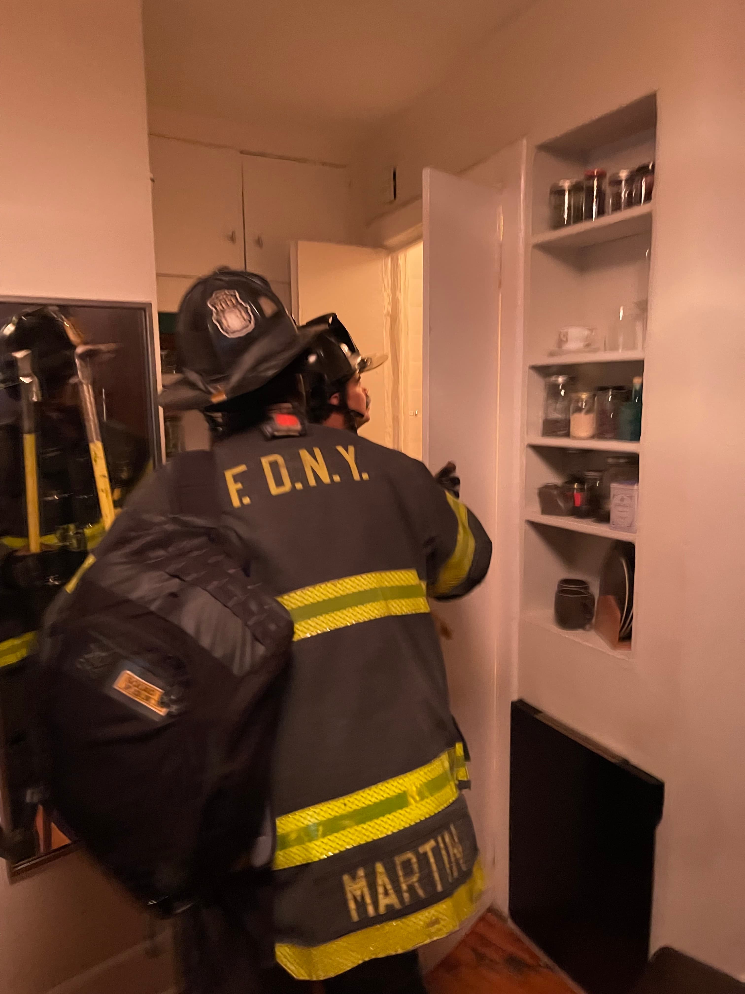 An FDNY firefighter inside Brown's apartment at 18 Gay Street, January 1, 2023