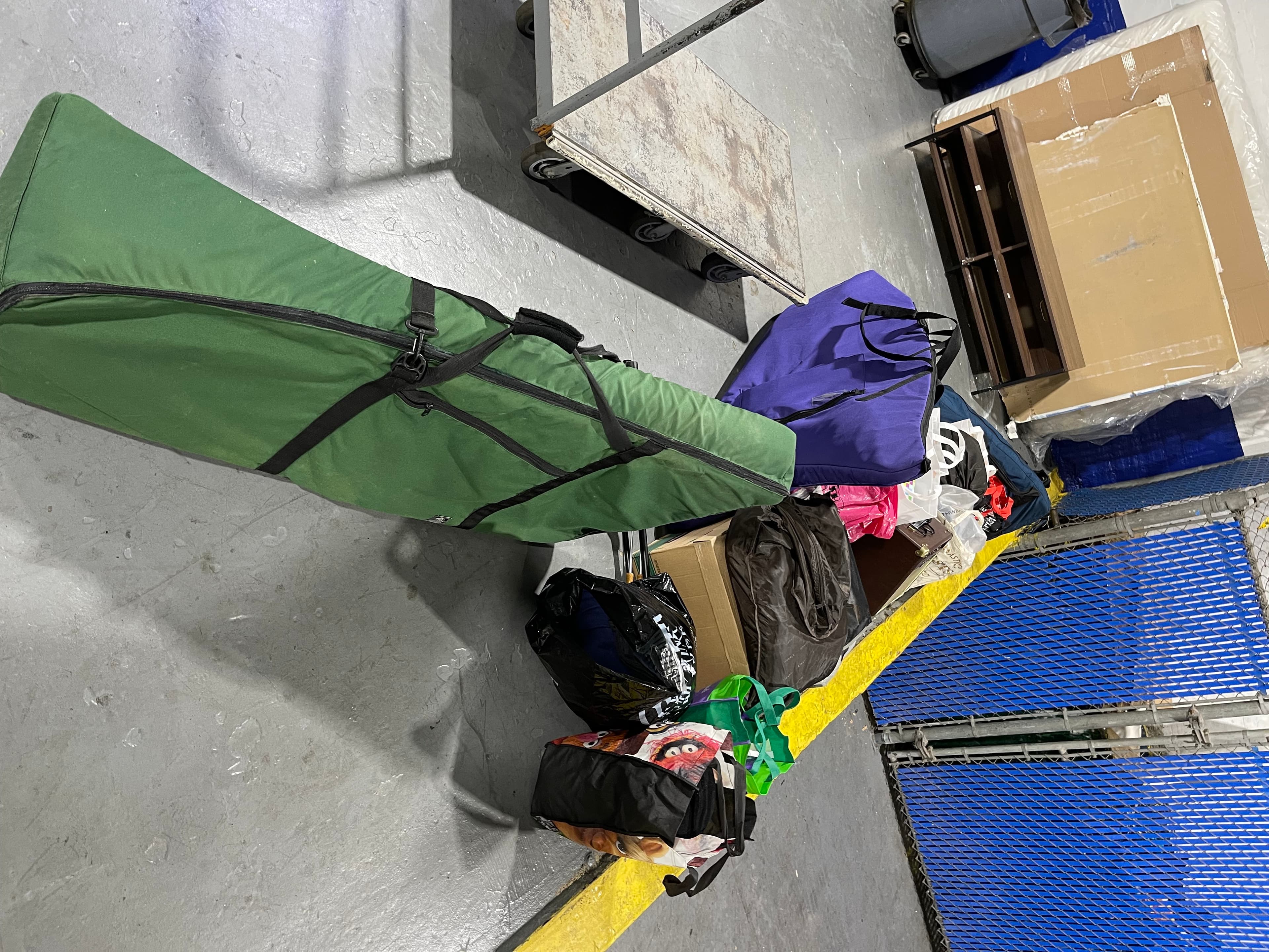 Brown's harp case and other belongings packed for storage after the apartment began cracking, January 2, 2023