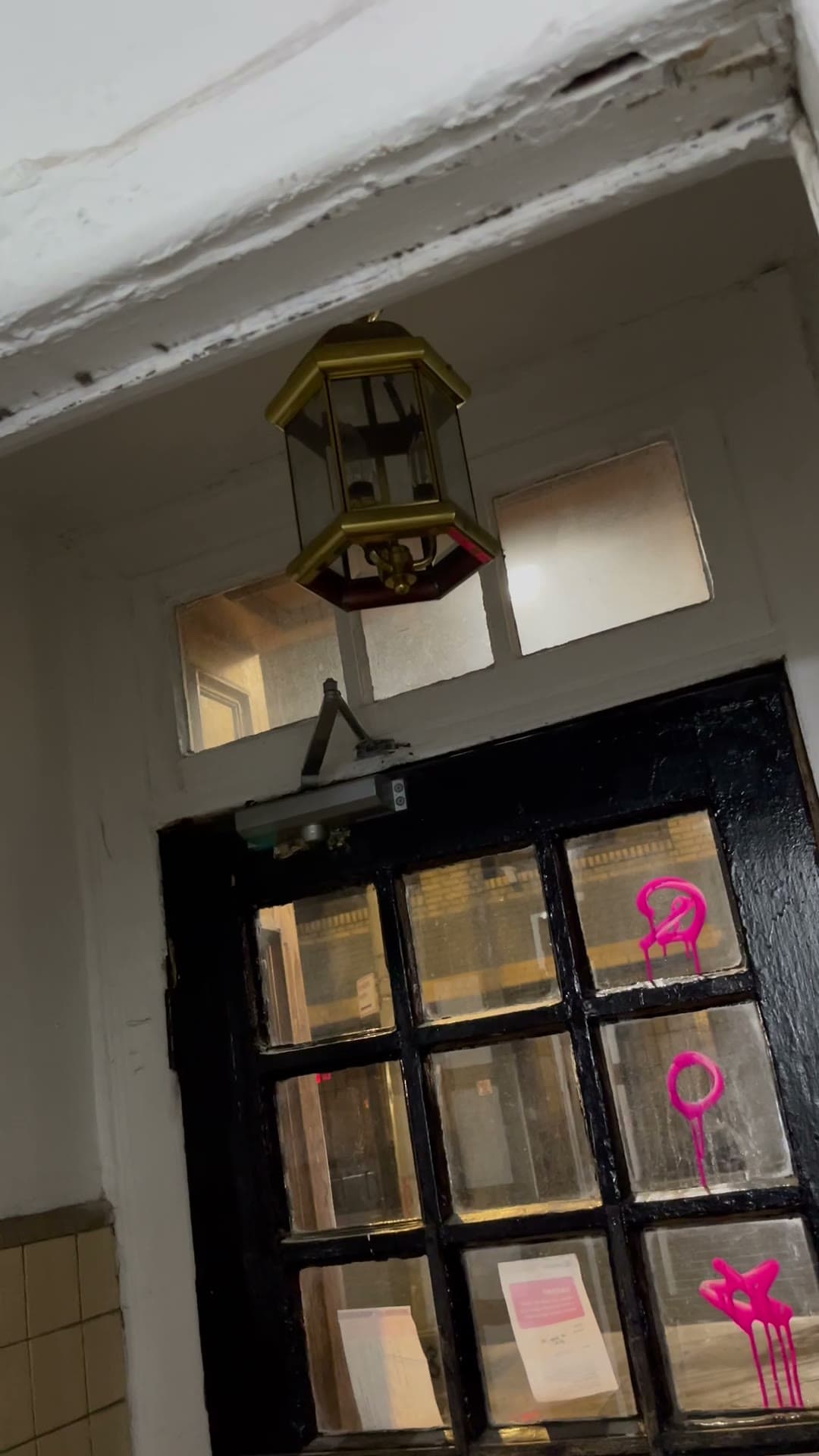 The disabled door lock and dark hallway at 18 Gay Street, May 2023