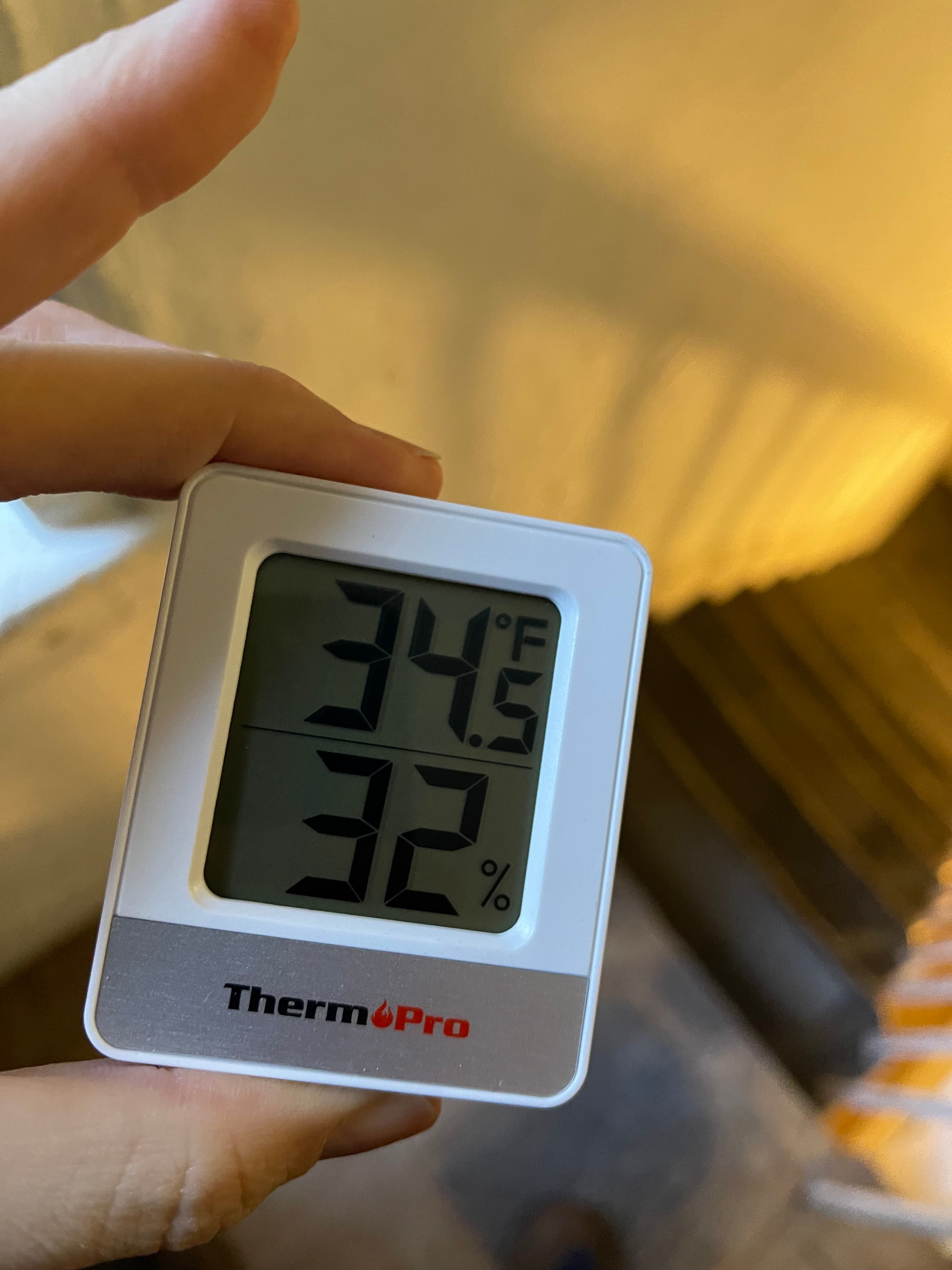 A ThermoPro thermometer inside 18 Gay Street reads 34.5°F and 32% humidity, January 22, 2025